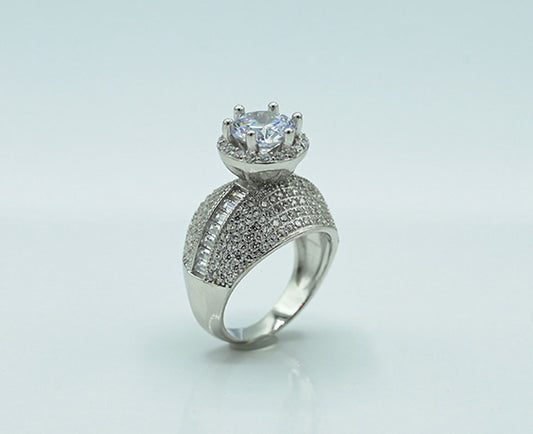 This exquisite Silver 925 ladies' ring is rhodium-plated for a brilliant finish, featuring a stunning spinel ruby at the center, accented with sparkling zircons, adding a touch of elegance and luxury to any collection.