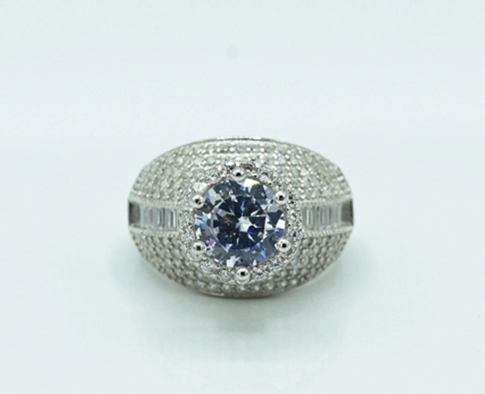 This exquisite Silver 925 ladies' ring is rhodium-plated for a brilliant finish, featuring a stunning spinel ruby at the center, accented with sparkling zircons, adding a touch of elegance and luxury to any collection.